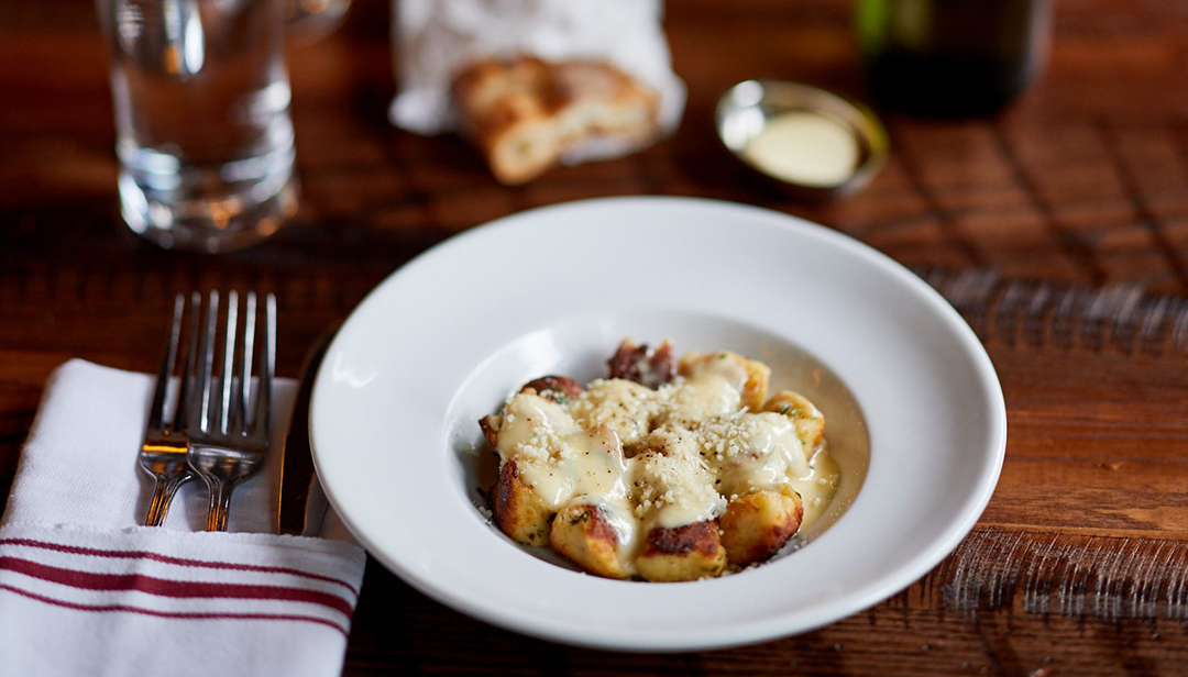 A photo of the toasted ricotta gnocchi with white truffle cream at The Smith